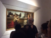 Art History professor lectures in front of Leonardo's "Annunciation" in the Uffizi Gallery of Florence